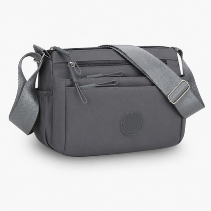 7 Reasons Smart Women Are Ditching Their “Black Hole” Bags for This Genius Multi-Pocket Crossbody