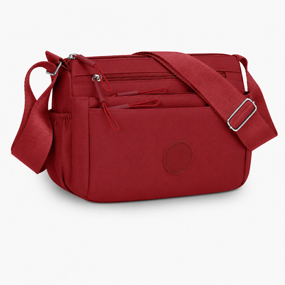 7 Reasons Smart Women Are Ditching Their “Black Hole” Bags for This Genius Multi-Pocket Crossbody