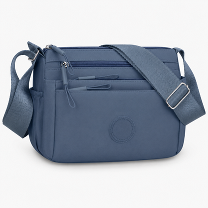 7 Reasons Smart Women Are Ditching Their “Black Hole” Bags for This Genius Multi-Pocket Crossbody