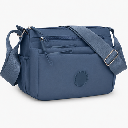 7 Reasons Smart Women Are Ditching Their “Black Hole” Bags for This Genius Multi-Pocket Crossbody